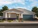 Inviting single-story home with stone accents, desert landscaping, and attached two-car garage at 4813 N 177Th Ln, Goodyear, AZ 85395