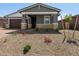 Charming single-story home with low-maintenance desert landscaping and stylish stone accents at 4813 N 177Th Ln, Goodyear, AZ 85395