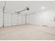 Spacious garage ready for vehicles and storage, featuring an automatic door and ample room for various needs at 4813 N 177Th Ln, Goodyear, AZ 85395