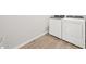 A well-equipped laundry room boasts tile flooring and modern, white washer and dryer units for efficient laundry care at 4813 N 177Th Ln, Goodyear, AZ 85395