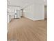 Spacious living area with wood-style tile flooring, adjacent to kitchen at 4813 N 177Th Ln, Goodyear, AZ 85395