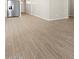 Open-concept living area with wood-style floors and modern appliances at 4813 N 177Th Ln, Goodyear, AZ 85395