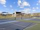 Community pickleball courts with blue and green surfaces, black fencing, and shaded picnic pavilion at 4813 N 177Th Ln, Goodyear, AZ 85395