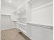 Spacious walk-in closet with built-in shelving, providing ample storage solutions and organization at 4813 N 177Th Ln, Goodyear, AZ 85395