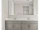 Bathroom featuring double vanity with a large mirror and ample storage space at 4819 N 177Th Ln, Goodyear, AZ 85395