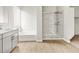 Stylish bathroom with soaking tub, walk-in shower and wood-look tile flooring at 4819 N 177Th Ln, Goodyear, AZ 85395