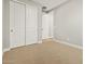 Carpeted bedroom featuring a sliding door closet with a minimalist design at 4819 N 177Th Ln, Goodyear, AZ 85395