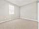 Inviting bedroom featuring a window and neutral-toned carpet at 4819 N 177Th Ln, Goodyear, AZ 85395