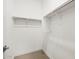 A well-organized walk-in closet with ample shelving and clothing rods at 4819 N 177Th Ln, Goodyear, AZ 85395