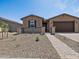 Attractive single-story home with desert landscaping and a two-car garage at 4819 N 177Th Ln, Goodyear, AZ 85395