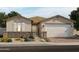 Charming single-story home showcasing desert landscaping and a welcoming two-car garage at 4819 N 177Th Ln, Goodyear, AZ 85395