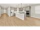 Open concept kitchen featuring a center island with sleek countertops and grey cabinetry at 4819 N 177Th Ln, Goodyear, AZ 85395