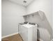 Functional laundry room with modern washer, dryer and overhead shelf at 4819 N 177Th Ln, Goodyear, AZ 85395