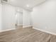 Bright living room features wood-look tile flooring, neutral paint, and recessed lighting at 4819 N 177Th Ln, Goodyear, AZ 85395