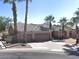 Beautiful single-story home featuring well-manicured landscaping, a three-car garage, and desert accents like palm trees at 665 W Beechnut Dr, Chandler, AZ 85248