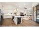 Bright open-concept kitchen with modern appliances, a spacious center island, and lots of counter space at 665 W Beechnut Dr, Chandler, AZ 85248
