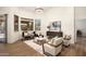 Sun-filled living room showcasing stylish decor, including hardwood floors, and comfortable seating at 665 W Beechnut Dr, Chandler, AZ 85248