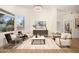 Bright and airy living room with high ceilings, modern furnishings, and large windows at 665 W Beechnut Dr, Chandler, AZ 85248