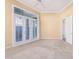 Bedroom with plush carpeting, a ceiling fan, and natural light from shuttered windows at 7538 E Tuckey Ln, Scottsdale, AZ 85250