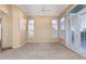 Bedroom featuring plush carpeting, natural light, and shuttered windows at 7538 E Tuckey Ln, Scottsdale, AZ 85250