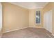 Neutral bedroom with carpet, a ceiling fan, shutters, and a closet, ready for your personal touch at 7538 E Tuckey Ln, Scottsdale, AZ 85250