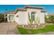Inviting single-story home featuring desert landscaping, a tile roof, and an attached garage at 7538 E Tuckey Ln, Scottsdale, AZ 85250