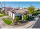 Aerial view of house with desert landscaping, a tile roof, trimmed shrubs, and a privacy wall at 7538 E Tuckey Ln, Scottsdale, AZ 85250