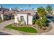 Aerial of home with mature landscaping, grass yard, desert plants, a tile roof, and trimmed shrubs at 7538 E Tuckey Ln, Scottsdale, AZ 85250