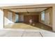 Spacious garage featuring ample storage cabinets, a window, and convenient access doors at 7538 E Tuckey Ln, Scottsdale, AZ 85250