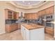 Gourmet kitchen featuring custom cabinets, stone countertops, and a center island at 7538 E Tuckey Ln, Scottsdale, AZ 85250