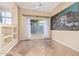 Inviting living room with travertine flooring, built-in shelving, and ample natural light, offering a comfortable space at 7538 E Tuckey Ln, Scottsdale, AZ 85250