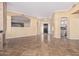 Spacious living room featuring tile floors, neutral walls, and an open floor plan at 7538 E Tuckey Ln, Scottsdale, AZ 85250
