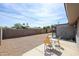 Spacious backyard area featuring a gravel ground cover and a quaint patio set at 811 E Seldon Ln, Phoenix, AZ 85020