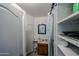Small bathroom with open shelving, updated mirror, and vanity at 811 E Seldon Ln, Phoenix, AZ 85020