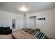 Bedroom featuring neutral walls, tiled floors and a comfortable bed at 811 E Seldon Ln, Phoenix, AZ 85020