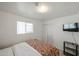 Bright bedroom features neutral decor, tiled floors, closet and view to front yard at 811 E Seldon Ln, Phoenix, AZ 85020