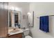 Half-bathroom features a modern vanity and mirror at 8315 E Lobo Ave, Mesa, AZ 85209
