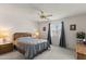 Well-lit bedroom featuring a ceiling fan, a neutral color scheme, and ample natural light at 8315 E Lobo Ave, Mesa, AZ 85209