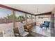 Cozy sun room with tiled floors, large windows, and comfortable seating at 8315 E Lobo Ave, Mesa, AZ 85209