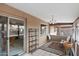 Bright sun room with tiled floors, large windows, and comfortable seating at 8315 E Lobo Ave, Mesa, AZ 85209