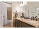 Bathroom features a dual sink vanity with granite countertops and stone accents at 851 N Citrus Cove --, Mesa, AZ 85213