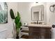 Elegant half-bathroom with a granite countertop and a decorative plant for a natural, sophisticated touch at 851 N Citrus Cove --, Mesa, AZ 85213