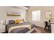 Comfortable bedroom featuring wood floors, textured walls, and cozy decor at 851 N Citrus Cove --, Mesa, AZ 85213