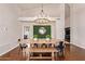 Formal dining area featuring a large dining table and elegant light fixture at 851 N Citrus Cove --, Mesa, AZ 85213
