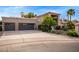 Spacious three-car garage and extended driveway with mature desert landscaping at 851 N Citrus Cove --, Mesa, AZ 85213