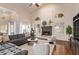 Bright living room with a cozy fireplace and views of the backyard at 851 N Citrus Cove --, Mesa, AZ 85213