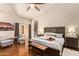 Comfortable bedroom features a sliding glass door and stylish furnishings, with hardwood floors at 851 N Citrus Cove --, Mesa, AZ 85213