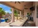 Outdoor patio with a long table, ceiling fans, hanging swing chairs, and string lights at 851 N Citrus Cove --, Mesa, AZ 85213