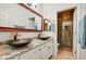 Modern bathroom with double sinks, granite countertops, and a glass-enclosed shower at 911 E Desert Inn Dr, Chandler, AZ 85249