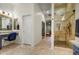 Elegant bathroom featuring a glass shower, vanity area, and stylish fixtures at 911 E Desert Inn Dr, Chandler, AZ 85249